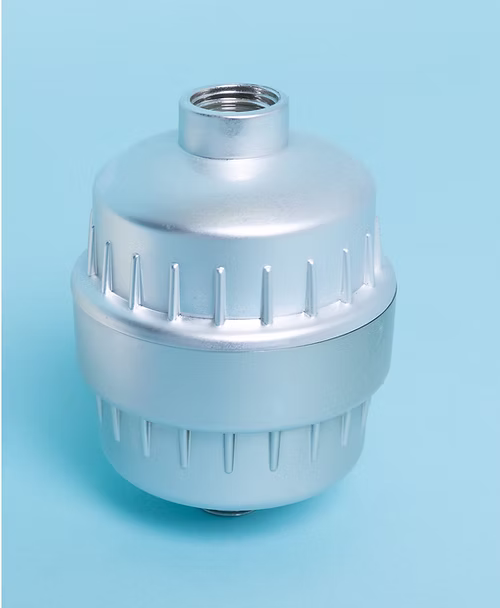 Universal Multi-Stage High Output Shower Filter , a silver, metallic, cylindrical universal shower filter, wrapped in a clear plastic bag, with visible threading and ridges for grip.